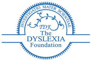 Blue circular logo of The Dyslexia Foundation with Latin text "INVESTIGATIO MATER SCIENTIAE" around the edge. Innen, a vine-like design with "TDF" and the words "The Dyslexia Foundation" in the center.
