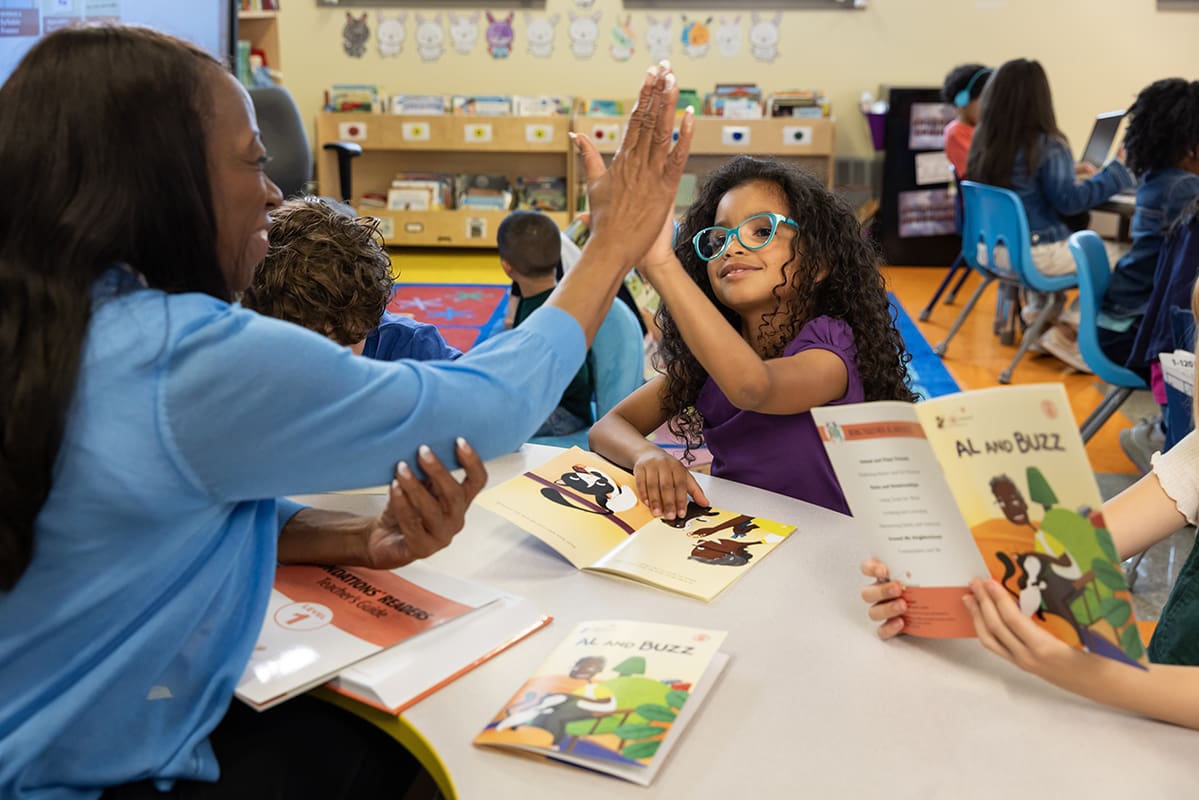 Teaching giving a student a high-five